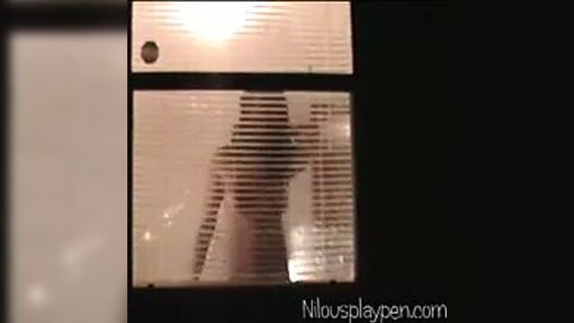 Voyeur Peeping Tom thru a friends window