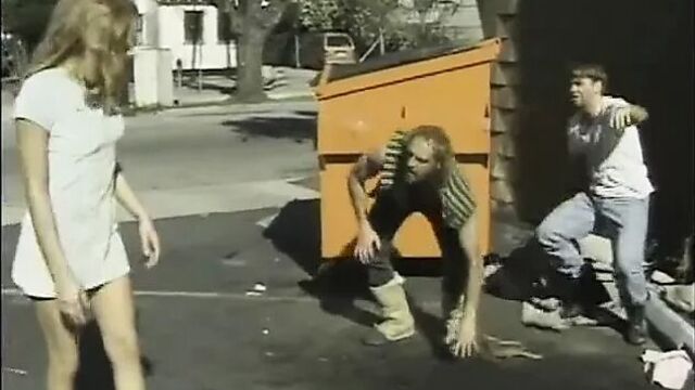 Young girl in side street hook by homeless